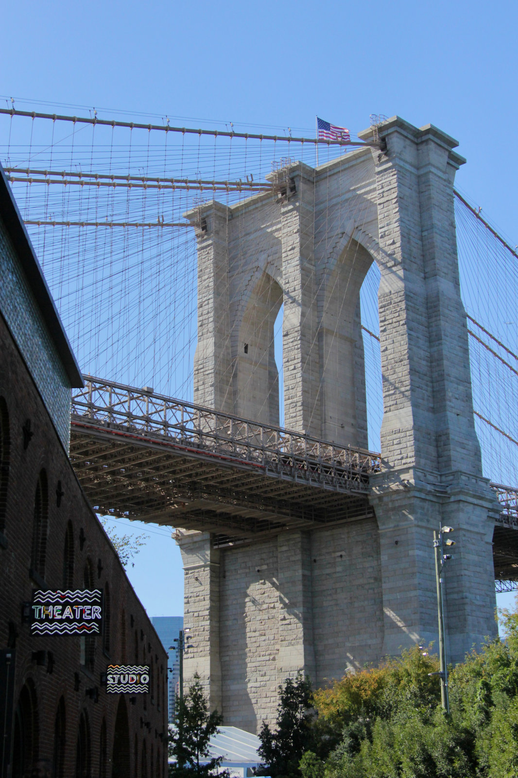 Portrait session on a DUMBO street with the Manhattan Bridge behind